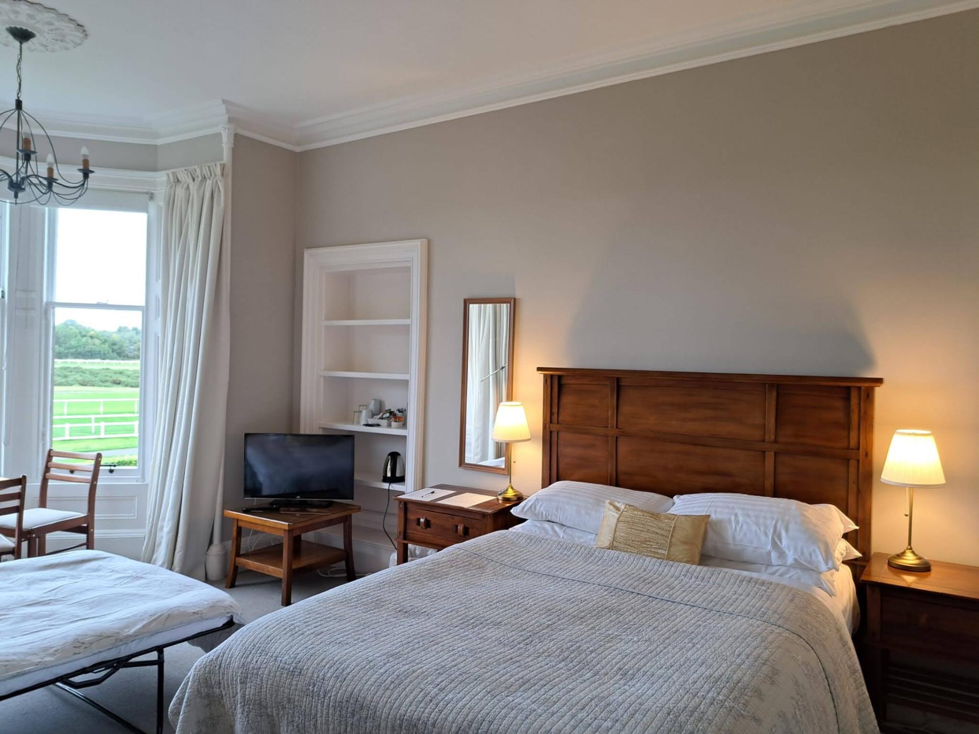 Standard double room with shared shower room and extra sofabed